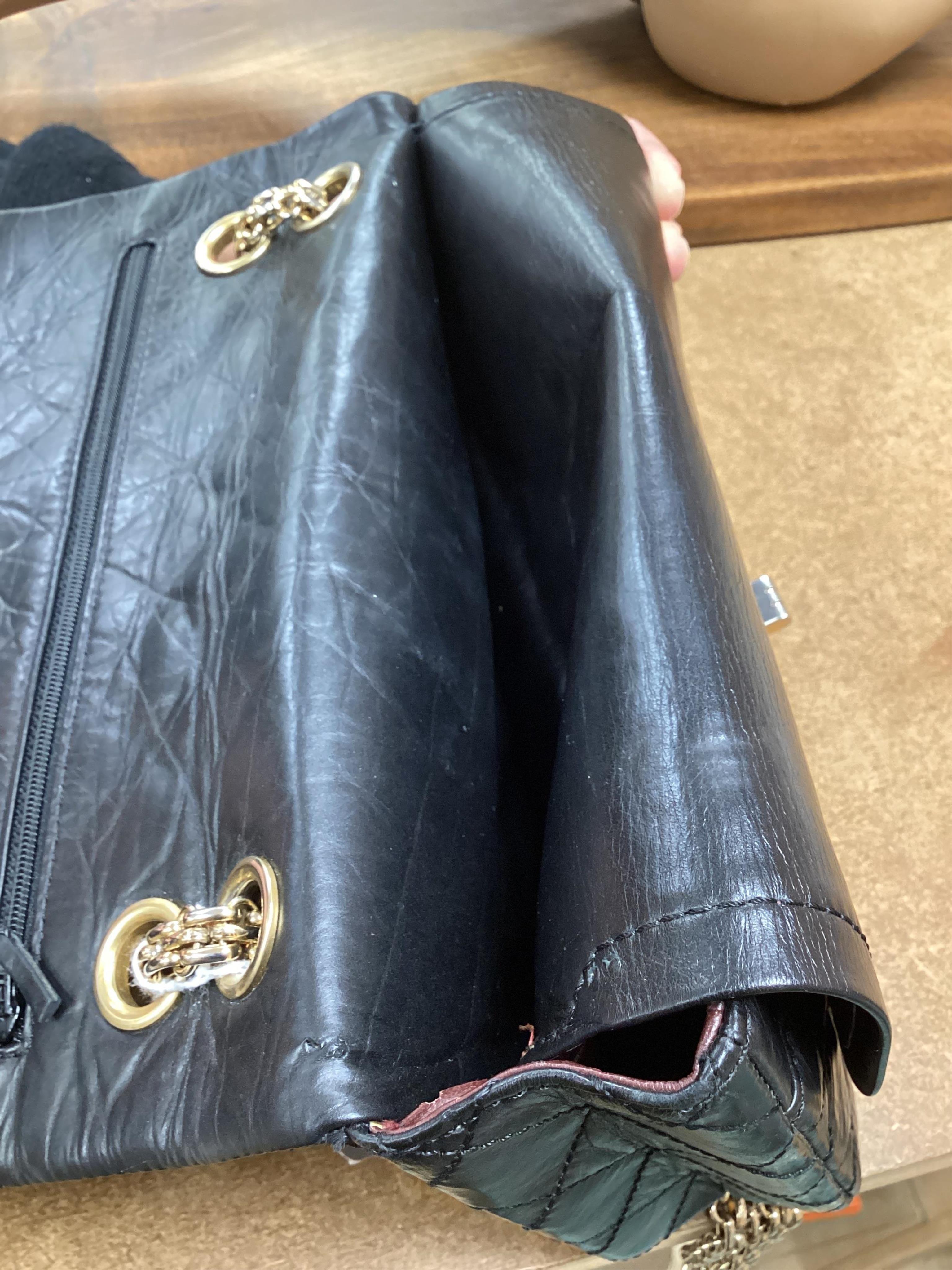 A Chanel 2.55 black leather handbag